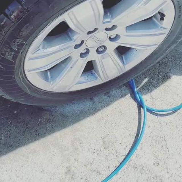 Alloy wheel being rinsed